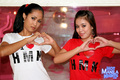 Amanda and sarah wearing tshirts making hearts